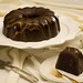 Moist chocolate bundt cake topped with ganache icing and drizzled with caramel glaze.