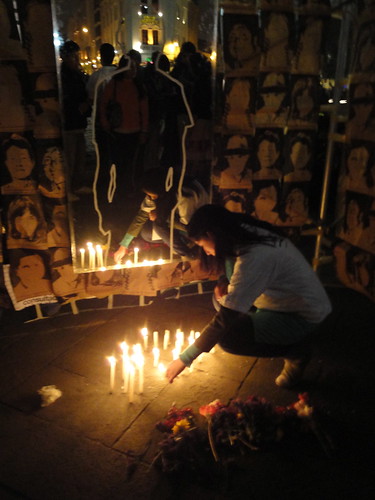 Lighting candles for the disappeared at Lima's Plaza San Martin