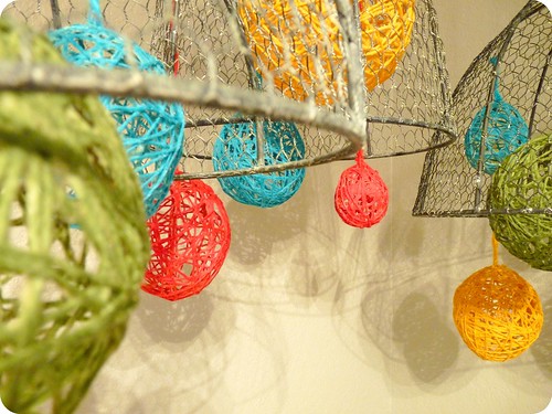 string ball and chicken wire bowl mobile in nursery