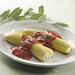 Two manicotti with a delicate ricotta cheese filling, cloaked with fresh tomato sauce and dusted with fresh parmesan cheese.