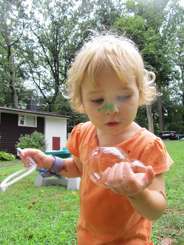 holding bubbles in her hand