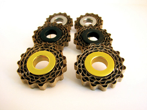 three pairs of corrugated cardboard earrings with gold, black, or silver filler tubes