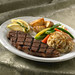 Grilled strip loin of beef (6 oz) served with a perfectly seasoned Maryland style backfin/lump crab cake (3 ½ oz)