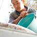 A worker from the Ak Zhalga Milk Collection Station in the village of Altymysh, Kyrgyzstan, collects milk