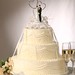 This all white cake pays special attention to detail.  Scrolling design and intricate string work make this cake truly perfect.  Add your own cake topper to finish (not included).