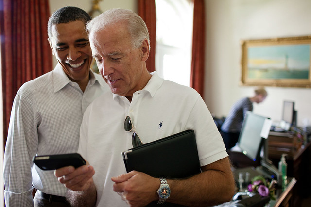 Vice President Joe Biden and President Barack Obama look at an app on an iPhone in the Outer Oval Office, Saturday, July 16, 2011. (Official White House Photo by Pete Souza)