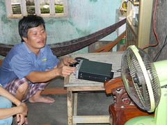 Mr. My who is blind, provides weather updates for local fishermen with his radio