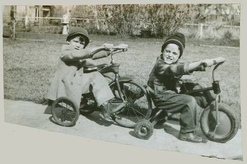 Two children on tricycles