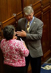 Rep. Ackert discusses an upcoming bill with a staff member during legislative session on the floor of the House of Representatives 